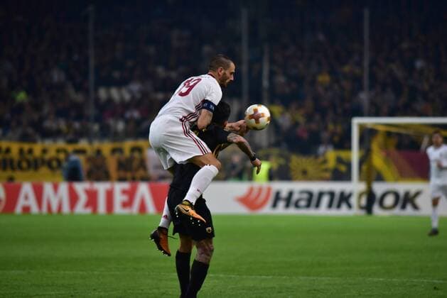 Italy: AEK versus Milan Leonardo Bonucci (no 19) of Milan tries to steal the ball from Sergio Araujo (no 11) of AEK. Athens Attiki Greece OAKA Spiros Louis  DimitriosxKarvountzisx xPacificxPress