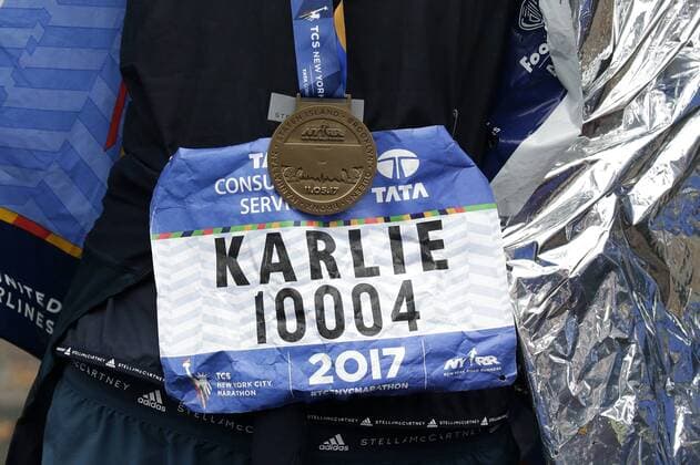 Super Model Karlie Kloss wears her Marathon Medal after she crosses the finish line completing the NYRR TCS New York City Marathon in New York City on November 5, 2017. 50,000 runners from the Big Apple and around the world raced through the five boroughs on a course that winds its way from the Verrazano Bridge before crossing the finish line by Tavern on the Green in Central Park.  NYP20171105143 JOHNxANGELILLO