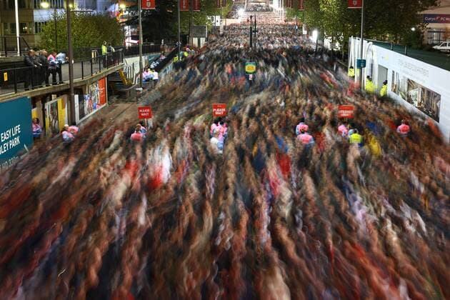 Football fans are blurred as they leave Wembley Stadium after the England v Germany friendly international at Wembley Stadium, London, on November 10, 2017. 