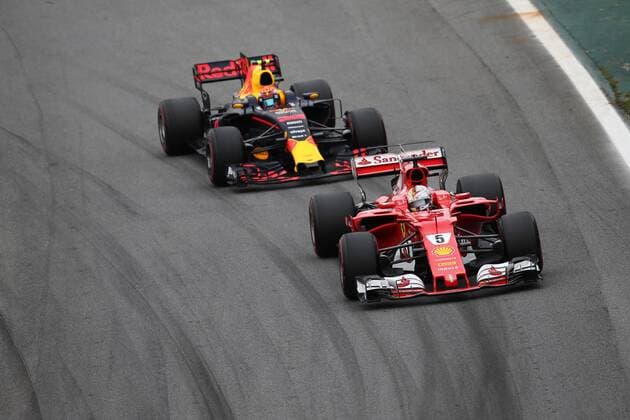 11.11.2017 - Qualifying, Sebastian Vettel (GER) Scuderia Ferrari SF70H and Max Verstappen (NED) Red Bull Racing RB13 Brazilian Grand Prix, Sao Paulo, Interlagos 9 - 12 November 2017 11.11.2017 - Qualifying, Sebastian Vettel (GER) Scuderia Ferrari SF70H and Max Verstappen (NED) Red Bull Racing RB13 