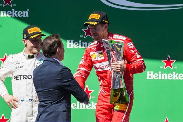 November 12, 2017 - Sao Paulo, Sao Paulo, Brazil - Nov, 2017 - Sao Paulo, Sao Paulo, Brazil - In the photo VETTEL receives the trophy from the hands of the mayor of Sao Paulo JOAO DORIA. German driver SEBASTIAN VETTEL Scuderia Ferrari won the Brazilian Formula One Grand Prix on Sunday at the Interlagos autodromo in Sao Paulo. VALTTERI BOTTAS Mercedes AMG was second place, followed by filipinos KIMI RAIKKONEN Scuderia Ferrari. F1 2017: Brazil Grand Prix: Race - ZUMAc168 20171112_zap_c168_037 Copyright: xMarceloxChellox