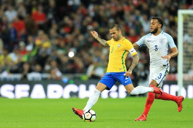 14th November 2017, Wembley Stadium, London, England; International football friendly, England versus Brazil; Dani Alves of Brazil is under pressure from Ryan Bertrand of England  ActionPlus11951254