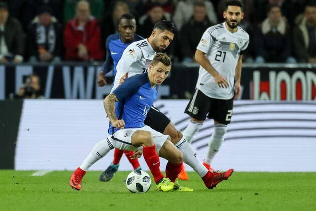 Koeln, Deutschland, 14.11.2017, Laenderspiel, Deutschland - Frankreich, Lucas Digne (FRA) und Emre Can (GER) im Zweikampf ( DeFodi048