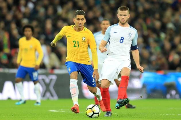14th November 2017, Wembley Stadium, London, England; International football friendly, England versus Brazil; Eric Dier of England is under pressure from Roberto Firmino of Brazil  ActionPlus11951533