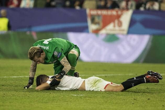 November 21, 2017 - Seville, Spain - LORIS KARIUS of Liverpool attendes to PABLO SARABIA of Sevilla during the UEFA Champions League Group E soccer match between Sevilla FC and Liverpool FC at Estadio Ramon Sanchez Pizjuan Soccer 2017 - Sevilla FC vs Liverpool FC - ZUMAa142 20171121_zap_a142_029 Copyright: xDanielxGonzalezxAcunax