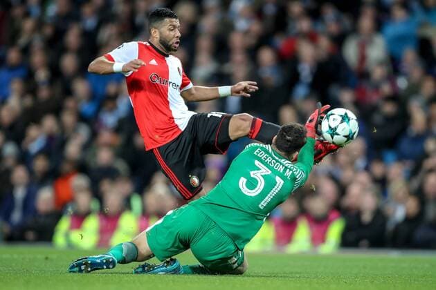 21st November 2017, Etihad Stadium, Manchester, England; UEFA Champions League, Manchester City versus Feyenoord; Ederson of Manchester City just manages to get finger tips on the ball to stop Tonny Vilhena of Feyenoord from scoring  ActionPlus11954441
