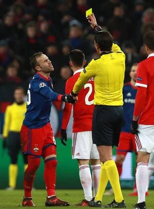 MOSCOW, RUSSIA â€“ NOVEMBER 22, 2017: Referee Deniz Aytekin shows the yellow card to CSKA Moscow s Bibras Natkho (R-L front) in their 2017 18 UEFA Champions League Group A Round 5 football match against Benfica Lisbon at VEB Arena. Sergei Fadeichev TASS  TS06A30E