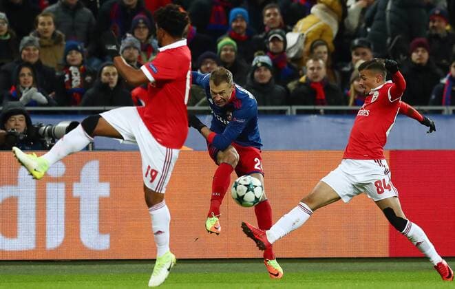 MOSCOW, RUSSIA â€“ NOVEMBER 22, 2017: CSKA Moscow s Vasily Berezutsky (C), Benfica Lisbonâ€™s Eliseu (L) and Diogo Goncalves in their 2017 18 UEFA Champions League Group A Round 5 football match at VEB Arena; CSKA won 2-0. Stanislav Krasilnikov TASS  TS06A2CB