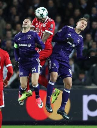 Anderlecht s Sofiane Hanni, Bayern s Jerome Boateng and Anderlecht s Lukasz Teodorczyk fight for the ball during a soccer match between Belgian club RSC Anderlecht and German team FC Bayern Munchen, Wednesday 22 November 2017 in Brussels, game five out of six in the group stage (Group B) of the UEFA Champions League competition. VIRGINIExLEFOUR  x05206604x