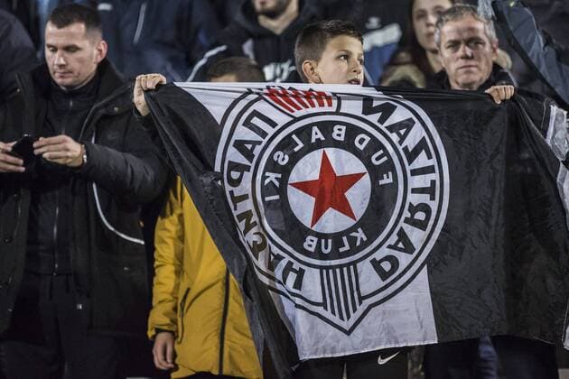 23rd November 2017, Partizan Stadium, Serbia, Belgrade; UEFA Europa League, Partizan versus Young Boys; A young fan of Partizan cheers during the match with team flag  ActionPlus11955133