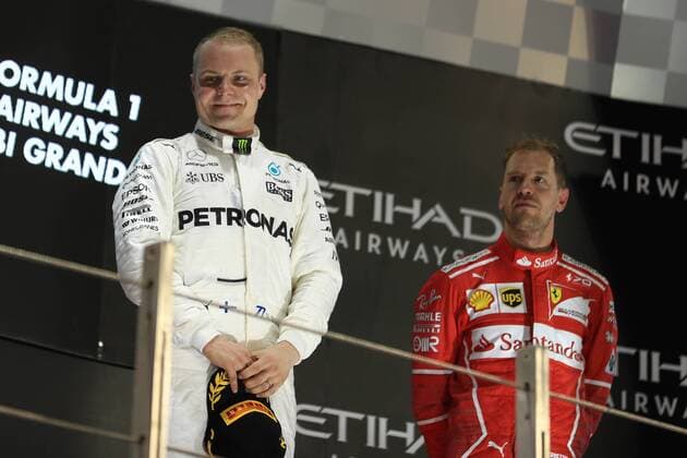 26th November 2017, Yas Marina Circuit, Abu Dhabi, UAE; Abu Dhabi Formula One Grand Prix, Sunday race day; Valtteri Bottas - Mercedes AMG Petronas F1 Team wins the race talks with Sebastian Vettel - Scuderia Ferrari  ActionPlus11956621
