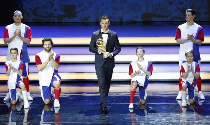 2018 World Cup draw Former Germany striker Miroslav Klose walks on stage with the World Cup trophy at the draw for the 2018 soccer World Cup finals in Moscow on Dec. 1, 2017. 