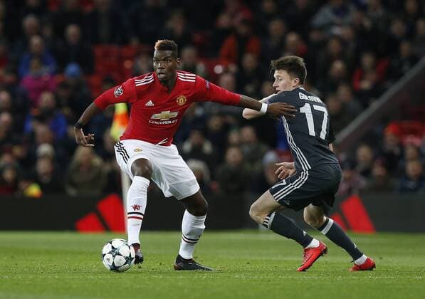 Paul Pogba of Manchester United ManU gets in front of Aleksandr Golovin of CSKA Moscow during the Champions League Group A match at the Old Trafford, Manchester. Picture date: December 5th 2017. Picture credit should read: Andrew Yates Sportimage EDITORIAL USE ONLY. No use with unauthorised audio, video, data, fixture lists, club league logos or live services. Online in-match use limited to 120 images, no video emulation. No use in betting, games or single club league player publications.