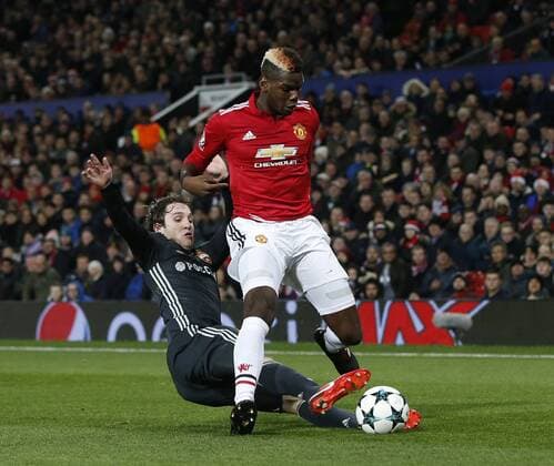 Paul Pogba of Manchester United ManU tackled by Mario Fernandes of CSKA Moscow during the Champions League Group A match at the Old Trafford, Manchester. Picture date: December 5th 2017. Picture credit should read: Andrew Yates Sportimage EDITORIAL USE ONLY. No use with unauthorised audio, video, data, fixture lists, club league logos or live services. Online in-match use limited to 120 images, no video emulation. No use in betting, games or single club league player publications.