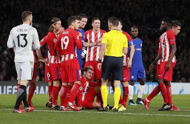 Antoine Griezmann of Atrletico Madrid is brought down by Gary Cahill of Chelsea during the Champions League Group C match at the Stamford Bridge, London. Picture date: December 5th 2017. Picture credit should read: David Klein Sportimage EDITORIAL USE ONLY. No use with unauthorised audio, video, data, fixture lists, club league logos or live services. Online in-match use limited to 120 images, no video emulation. No use in betting, games or single club league player publications.