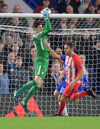 Chelsea v Atletico Madrid UEFA Champions League Thibaut Courtois of Chelsea takes a cross during the UEFA Champions League match at Stamford Bridge, London Content Not Available For UK Newspapers Copyright: xSimonxDaelx FIL-11053-0016