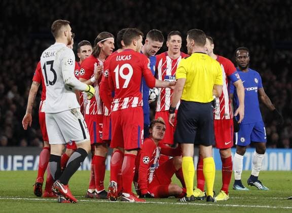 Antoine Griezmann of Atrletico Madrid is brought down by Gary Cahill of Chelsea during the Champions League Group C match at the Stamford Bridge, London. Picture date: December 5th 2017. Picture credit should read: David Klein Sportimage EDITORIAL USE ONLY. No use with unauthorised audio, video, data, fixture lists, club league logos or live services. Online in-match use limited to 120 images, no video emulation. No use in betting, games or single club league player publications.