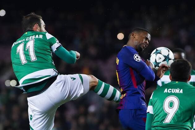 5th December 2017, Camp Nou, Barcelona, Spain; UEFA Champions League football, FC Barcelona Barca versus Sporting Lisbon; Nelson Semedo of FC Barcelona receives the high boot foul from Bruno Cesar of Sporting Lisbon  ActionPlus11959319