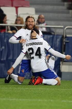 December 5, 2017 - Lisbon, Portugal - Basel s midfielder Mohamed Elyounoussi from Norway celebrates with Basel s defender Michael Lang from Suisse (L ) after scoring a goal during the UEFA Champions League Group A football match between SL Benfica and FC Basel at the Luz stadium in Lisbon, Portugal on December 5, 2017. SL Benfica v FC Basel - UEFA Champions League  - ZUMAn230 20171205_zaa_n230_373 Copyright: xPedroxFiuzax