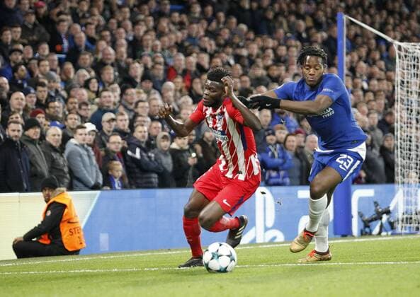 Thomas Partey of Atletico de Madrid holds off Michy Batshuayi of Chelsea FC during the UEFA Champions League match between Chelsea and Atletico Madrid at Stamford Bridge, London, England on 5 December 2017. Copyright: xCarltonxMyriex 18110074