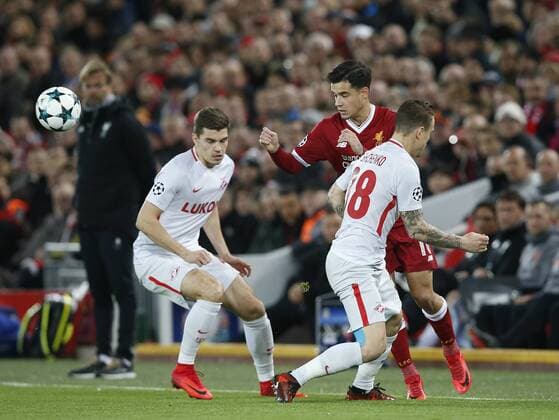 Philippe Coutinho of Liverpool tackled by Andrei Yeschenko of Spartak Moscow during the Champions League Group E match at the Anfield Stadium, Liverpool. Picture date: December 6th 2017. Picture credit should read: Andrew Yates Sportimage EDITORIAL USE ONLY. No use with unauthorised audio, video, data, fixture lists, club league logos or live services. Online in-match use limited to 120 images, no video emulation. No use in betting, games or single club league player publications.