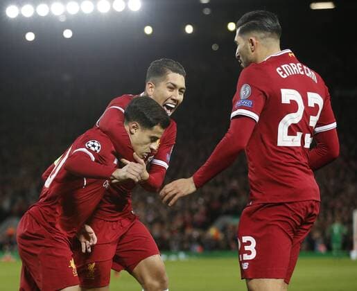 Philippe Coutinho of Liverpool celebrates scoring the penalty with Roberto Firmino of Liverpool during the Champions League Group E match at the Anfield Stadium, Liverpool. Picture date: December 6th 2017. Picture credit should read: Andrew Yates Sportimage EDITORIAL USE ONLY. No use with unauthorised audio, video, data, fixture lists, club league logos or live services. Online in-match use limited to 120 images, no video emulation. No use in betting, games or single club league player publications.