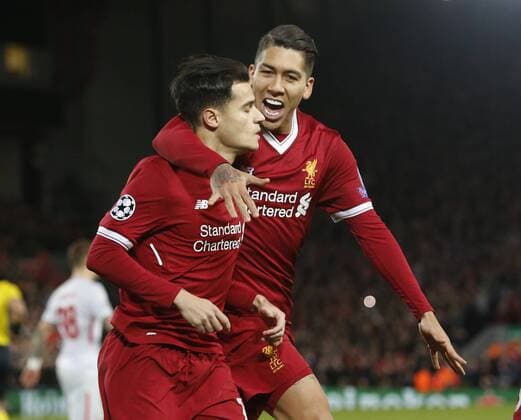 Philippe Coutinho of Liverpool celebrates scoring the penalty with Roberto Firmino of Liverpool during the Champions League Group E match at the Anfield Stadium, Liverpool. Picture date: December 6th 2017. Picture credit should read: Andrew Yates Sportimage EDITORIAL USE ONLY. No use with unauthorised audio, video, data, fixture lists, club league logos or live services. Online in-match use limited to 120 images, no video emulation. No use in betting, games or single club league player publications.