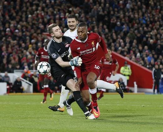 Daniel Sturridge of Liverpool tackled by Aleksandr Selikhov of Spartak Moscow during the Champions League Group E match at the Anfield Stadium, Liverpool. Picture date: December 6th 2017. Picture credit should read: Andrew Yates Sportimage EDITORIAL USE ONLY. No use with unauthorised audio, video, data, fixture lists, club league logos or live services. Online in-match use limited to 120 images, no video emulation. No use in betting, games or single club league player publications.