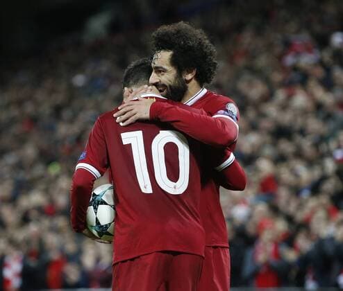Mohamed Salah of Liverpool celebrates with Philippe Coutinho of Liverpool during the Champions League Group E match at the Anfield Stadium, Liverpool. Picture date: December 6th 2017. Picture credit should read: Andrew Yates Sportimage EDITORIAL USE ONLY. No use with unauthorised audio, video, data, fixture lists, club league logos or live services. Online in-match use limited to 120 images, no video emulation. No use in betting, games or single club league player publications.