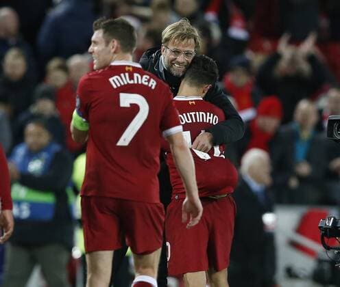 Jurgen Klopp manager of Liverpool hugs hat trick striker Philippe Coutinho of Liverpool during the Champions League Group E match at the Anfield Stadium, Liverpool. Picture date: December 6th 2017. Picture credit should read: Andrew Yates Sportimage EDITORIAL USE ONLY. No use with unauthorised audio, video, data, fixture lists, club league logos or live services. Online in-match use limited to 120 images, no video emulation. No use in betting, games or single club league player publications.