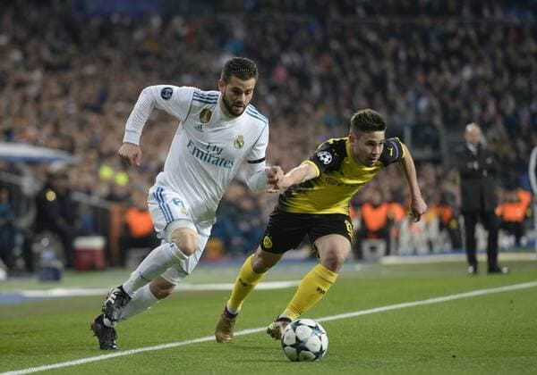 Real Madrid s Nacho Fernandez and Borussia Dortmund s Raphael Guerreiro during Champions League Group H match 6. December 6,2017.  (7042)