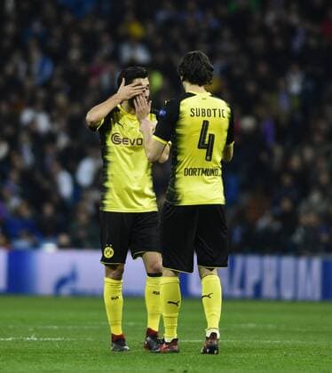 Real Madrid s and Borussia Dortmund s Nuri Sahin and Nuven Subotic during Champions League Group H match 6. December 6,2017.  (8425)
