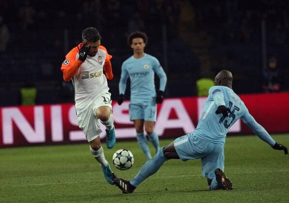 Defender Eliaquim Mangala (R) of Manchester City FC and midfielder Marlos of FC Shakhtar Donetsk are seen in action during the UEFA Champions League Group F match at the Metalist Stadium in Kharkiv, northeastern Ukraine, December 6, 2017. KHARKIV. FC Shakhtar Donetsk has beaten Manchester City FC 2-1 in the UEFA Champions League Group F match at Kharkiv s Metalist Stadium. Pitmen?s midfielder Bernard and defender Ismaily put their team in the lead in the first half (26?, 32? respectively). The visitors managed to score in added time when Manchester City?s forward Sergio Aguero took a successful penalty kick. Thus, FC Shakhtar Donetsk secured the second place in Group F and put an end to a winning streak of Manchester City FC this season. To celebrate his team?s victory, coach Paulo Fonseca appeared at the post-match news conference dressed as Zorro. The Shakhtar manager fulfilled his promise he had made if the Ukrainian champions reached the knockout stage of the Champions League. Shakhtar defeats Manchester City in Kharkiv  Copyright: xDanilxShamkinx