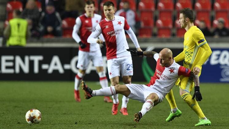 Miroslav Stoch of Slavia, left, and Igor Sitov of Astana in action during the 6th round, group A, European League soccer match SK Slavia Praha vs FC Astana in Prague, Czech Republic, December 7, 2017. (CTKxPhoto MichalxKamaryt) CTKPhotoP201712071085201  _KMT9355