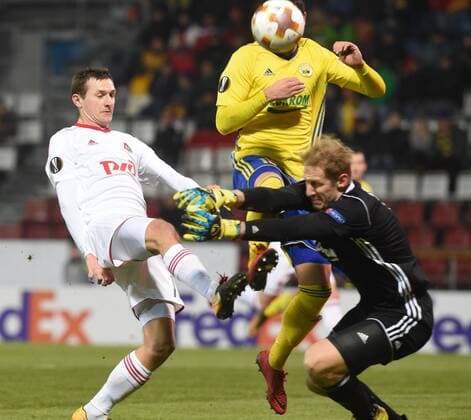 L-R Aleksandr Kolomeytsev of Lokomotiv and Zoran Gajic and goalkeeper Zdenek Zlamal of Zlin in action during the 6th round, group F, European League soccer match FC Fastav Zlin vs FC Lokomotiv Moscow in Olomouc, Czech Republic, December 7, 2017. (CTKxPhoto LudekxPerina) CTKPhotoP201712071073801  LPE 003