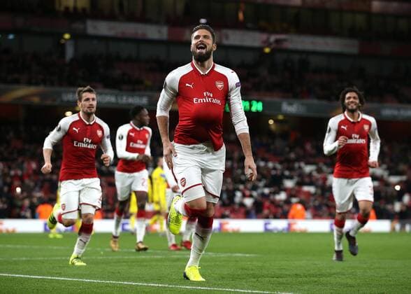 7th December 2017, Emirates Stadium, London, England; UEFA Europa League football, Arsenal versus BATE Borisov; Olivier Giroud of Arsenal celebrates by tucking the ball under his shirt after scoring his sides 5th goal from a penalty during the 2nd half to make it 5-0  ActionPlus11959812