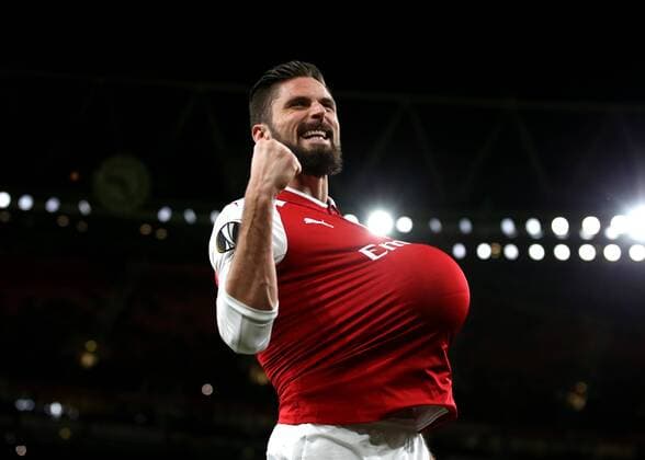 7th December 2017, Emirates Stadium, London, England; UEFA Europa League football, Arsenal versus BATE Borisov; Olivier Giroud of Arsenal celebrates by tucking the ball under his shirt after scoring his sides 5th goal from a penalty during the 2nd half to make it 5-0  ActionPlus11959815