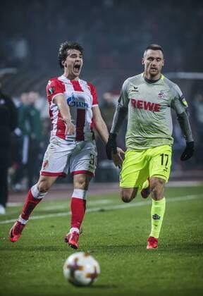 FuÃŸball, EL, Roter Stern Belgrad - 1. FC KÃ¶ln 7th December 2017, Rajko Mitic Stadium, Belgrade, Serbia, UEFA Europa League football, Red Star Belgrade versus FC Cologne; Defender Filip Stojkovic of Red Star Belgrade reacts after losing the ball in a tackle with Midfielder Christian Clemens of FC Kaln  ActionPlus11959824