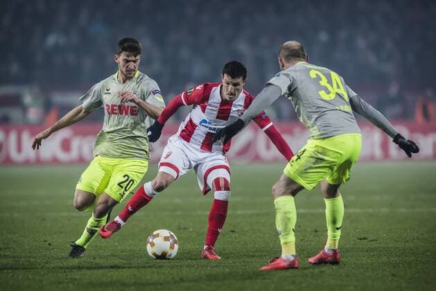 FuÃŸball, EL, Roter Stern Belgrad - 1. FC KÃ¶ln 7th December 2017, Rajko Mitic Stadium, Belgrade, Serbia, UEFA Europa League football, Red Star Belgrade versus FC Cologne; Midfielder Slavoljub Srnic of Red Star Belgrade challenges Defender Konstantin Rausch of FC Kaln and Midfielder Salih Ozcan of FC Kaln  ActionPlus11959831