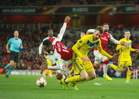 Nemanja MilunoviÄ‡ of FC BATE Borisov brings down Theo Walcott of Arsenal for a penalty during the UEFA Europa League match between Arsenal and BATE at the Emirates Stadium, London, England on 7 December 2017. Copyright: xVincexMignottx 18120024
