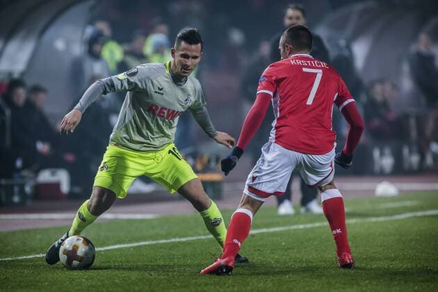 7th December 2017, Rajko Mitic Stadium, Belgrade, Serbia, UEFA Europa League football, Red Star Belgrade versus FC Cologne; Defender Pawel Olkowski of FC Kaln takes on Midfielder Nenad Krsticic of Red Star Belgrade  ActionPlus11959846