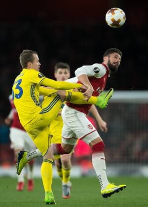 Olivier Giroud of Arsenal and Denis Polyakov of FC BATE Borisov during the UEFA Europa League match between Arsenal and BATE at the Emirates Stadium, London, England on 7 December 2017. Copyright: xVincexMignottx 18120049