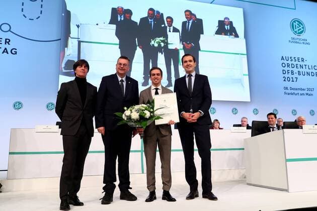 08.12.2017, xfux, Fussball Außerordentlicher DFB-Bundestag 2017, emspor v.l. Former German national player Philipp Lahm is awarded as German national team Nationalteam honorary team captain by DFB president Reinhard Grindel (2L), German national team head coach Joachim Loew (L) and DFB general secretary Dr.Friedrich Curtius (R) during the Extraordinary DFB Bundestag at Messe Frankfurt on December 8, 2017 in Frankfurt am Main, Germany. Frankfurt am Main