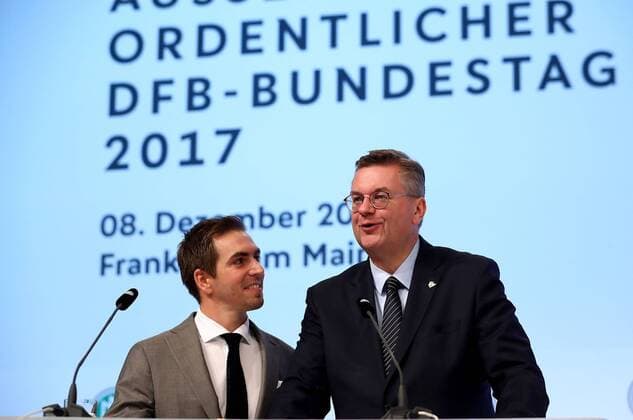 08.12.2017, xfux, Fussball Außerordentlicher DFB-Bundestag 2017, emspor v.l. Newly awared honorary team captain of the German national team Nationalteam and German UEFA EURO EM Europameisterschaft Fussball 2024 campaign ambassador Philipp Lahm (L) looks on whilst DFB president Reinhard Grindel talks to the audience during the Extraordinary DFB Bundestag at Messe Frankfurt on December 8, 2017 in Frankfurt am Main, Germany. Frankfurt am Main