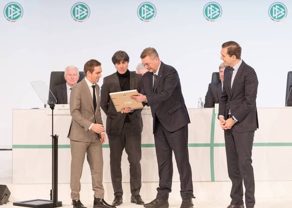 Frankfurt, GER, Hessen - December 08, Extraordinay DFB Bundestag, Congress Center . In the Picture: (L-R) Former German national player Philipp Lahm, German national team Nationalteam honorary team captain, German national team head coach Joachim Loew, DFB President Reinhard Grindel, DFB General Secretary Dr. Friedrich Curtius .