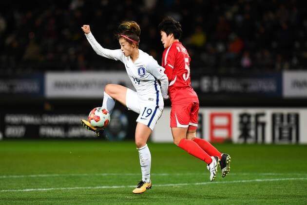 CHIBA, JAPAN - DECEMBER 11: Wi Jong Sim 12 of North Korea and Choe Yuri 19 of South Korea compete for the ball during the EAFF E-1 Women s Football Championship between North Korea and South Korea at Fukuda Denshi Arena on December 11, 2017 in Chiba, Japan.  Copyright: xVCGx CFP111140547105 