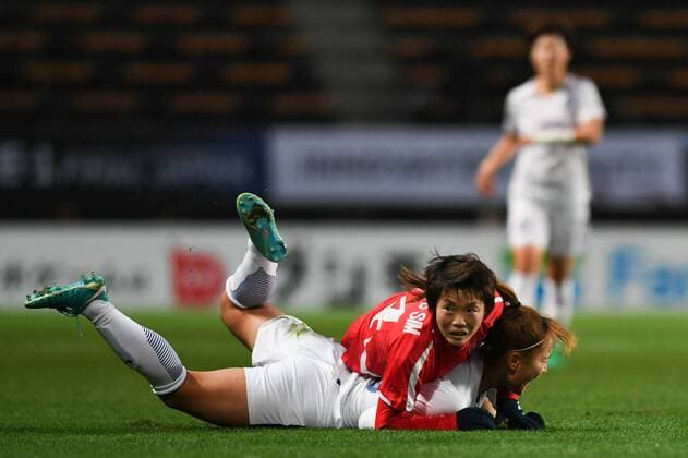 CHIBA, JAPAN - DECEMBER 11: Ri Hyang Sim 14 of North Korea and Jang Selgi 16 of South Korea compete for the ball during the EAFF E-1 Women s Football Championship between North Korea and South Korea at Fukuda Denshi Arena on December 11, 2017 in Chiba, Japan.  Copyright: xVCGx CFP111140541814 