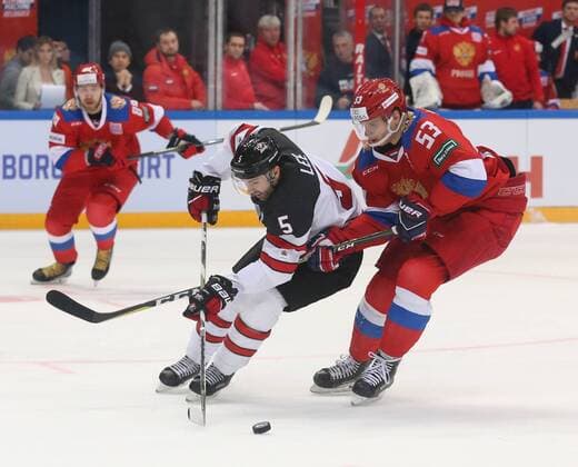 MOSCOW, RUSSIA â€“ DECEMBER 16, 2017: Canada s Chris Lee and Russiaâ€™s Alexei Marchenko (L-R front) in their 2017-18 Euro Hockey Tour Channel One Cup Ice hockey Eishockey match at the VTB Ice Palace. Anton Novoderezhkin TASS  TS06D665