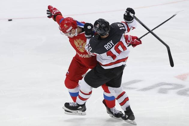 MOSCOW, RUSSIA â€“ DECEMBER 16, 2017: Russiaâ€™s Bogdan Kiselevich (L) and Canadaâ€™s Derek Roy in their 2017-18 Euro Hockey Tour Channel One Cup Ice hockey Eishockey match at the VTB Ice Palace. Mikhail Japaridze TASS  TS06D694