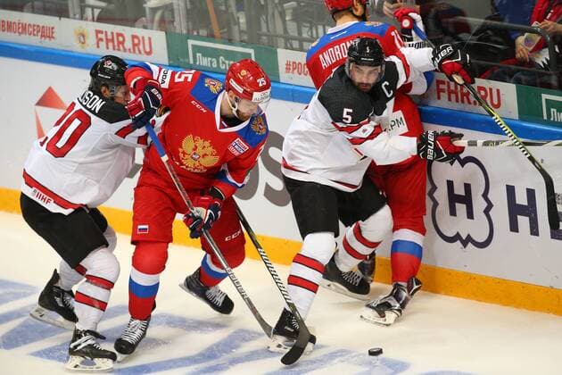 MOSCOW, RUSSIA â€“ DECEMBER 16, 2017: Russiaâ€™s Mikhail Grigorenko (C), Canadaâ€™s Matt Ellison (L) and Chris Lee (R front) in their 2017-18 Euro Hockey Tour Channel One Cup Ice hockey Eishockey match at the VTB Ice Palace. Anton Novoderezhkin TASS  TS06D699